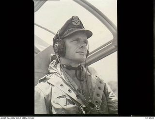 Cool concentration shows in every line of the face of 406559 Flight Lieutenant (Flt Lt) Edward Manton Christensen, while he was leading a flight of Beaufort Bomber aircraft of No. 100 Squadron RAAF ..