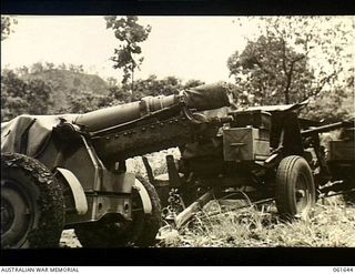 17 Mile, Port Moresby area, Papua. 1943-12-13. A 25 pounder mountain gun (left) and in the background a 2 pounder tank attack gun, both of which have been returned to the Returned Stores Depot, ..