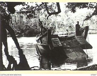 GOALING RIVER AREA, WEST NEW GUINEA. 1944-01-24. THIS JAPANESE BARGE WAS DISCOVERED BY AN INDIAN ARMY OFFICER ATTACHED TO THE 2/13TH FIELD COMPANY, ROYAL AUSTRALIAN ENGINEERS, LIEUTENANT WALLACE. ..