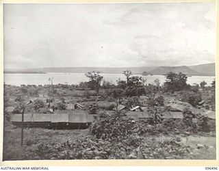 RABAUL, NEW BRITAIN, 1945-09-13. A VIEW FROM A HILL OVERLOOKING THE CAMP OF 4 FIELD AMBULANCE, ONE OF THE UNITS OF THE FORCE FROM 4 INFANTRY BRIGADE WHICH OCCUPIED RABAUL AFTER THE JAPANESE ..