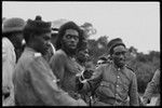 Group of men making an arrest, Malua Bay