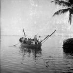 Coffin, mourners and Piula members in whaleboat leaving for burial islet