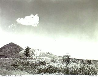 NEW BRITAIN, 1945-09. SMALL HILLOCKS OF VOLCANIC ORIGIN IN THE RABAUL AREA. (RNZAF OFFICIAL PHOTOGRAPH.)