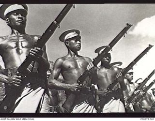 NATIVE CONSTABULARY RECRUITS OF THE  NEW GUINEA POLICE FORCE UNDERGOING MUSKETRY INSTRUCTION AT THE POLICE TRAINING DEPOT