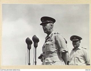 CAPE WOM, NEW GUINEA, 1945-09-13. MAJOR-GENERAL H.C.H. ROBERTSON, GENERAL OFFICER COMMANDING 6 DIVISION, ADDRESSING TROOPS OF 6 DIVISION, DURING THE SURRENDER CEREMONY HELD AT CAPE WOM AIRSTRIP. ..