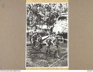 FAITA, NEW GUINEA. 1944-01-07. MEMBERS OF A PATROL LEAVING HEADQUARTERS 2/2ND COMMANDO SQUADRON FOR A TEN DAY TRIP THROUGH JAPANESE HELD TERRITORY. IDENTIFIED PERSONNEL ARE: LANCE CORPORAL L. H. ..