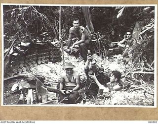 SATTELBERG AREA, NEW GUINEA. 1943-11-15. A MORTAR PLATOON OF THE 2/24TH AUSTRALIAN INFANTRY BATTALION IN ACTION DURING THE ASSAULT ON SATTELBERG. SHOWN ARE: VX25903 PRIVATE R. R. ADAMS OF ..