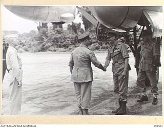 TOROKINA, BOUGAINVILLE. 1945-07-03. HIS ROYAL HIGHNESS, THE DUKE OF GLOUCESTER, GOVERNOR-GENERAL OF AUSTRALIA (1), BEING GREETED BY LIEUTENANT GENERAL S.G. SAVIGE, GENERAL OFFICER COMMANDING 2 ..