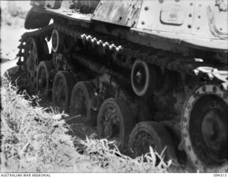 Cape Boram, Wewak area, New Guinea.  The tank track (viewed from the right side) of an armoured recovery variant of the medium type 97 Chi Ha tank, which was captured on the beach.  Army workshops, ..