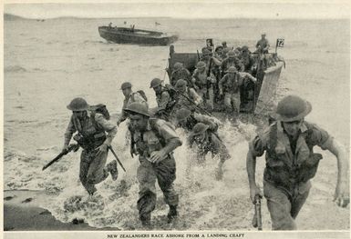 New Zealanders race ashore from a landing craft