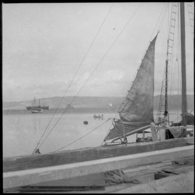 Sailing vessel beside a jetty with a partially hoisted sail, Rabaul Harbour, New Guinea, ca. 1936 / Sarah Chinnery