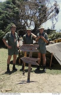 A camp, 8 Troop's home for around two weeks at the village of Pangi, Lifuka Island.  Left to right is Sapper Steve Ash, Lance Corporal Shane Harrop and Lance Corporal Bob West. This image relates ..