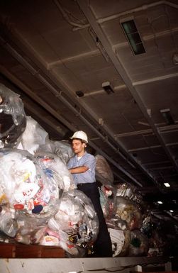 A member of the supply department of the nuclear-powered aircraft carrier USS ABRAHAM LINCOLN (CVN-72) checks plastic storage of trash in preparation for off loading as the ship prepares for arrival in Hawaii. The Navy does not dump trash at sea but returns it to shore for proper disposal