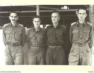 DUMPU, NEW GUINEA. 1944-01-25. OFFICERS OF HEADQUARTERS 7TH DIVISION. IDENTIFIED PERSONNEL ARE: SX11002 CAPTAIN D.F. SAUNDERS, G.III (LEARNER) (1); NGX62 CAPTAIN F.A. JACOBSEN G.III (I) (2); ..