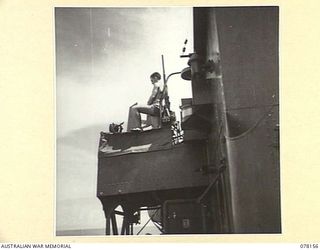 MIOS WUNDI, DUTCH NEW GUINEA. 1944-11-15. AN OERLIKON GUNNER MANNING HIS GUN ON THE BRIDGE OF THE ROYAL AUSTRALIAN NAVY VESSEL HMAS KIAMA