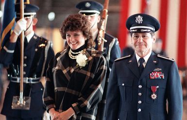 Colonel (COL) Arnald D. Gabriel, commander and conductor of the US Air Force Band, and his wife Renee Channey attend his retirement ceremony