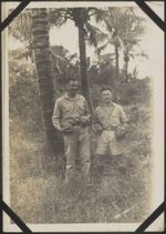 Kiwi soldiers holding coconuts in New Caledonia
