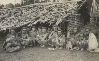 Shows the women and some men of the Beangi Morobe District, who live at a much greater height above sea level, than do their sisters