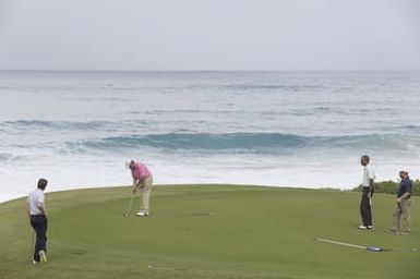 Barack Obama plays golf with Prime Minister Najib Razak, Joe Paulsen, and Mike Brush in Kaneohe Bay, Hawaii, December 24, 2014