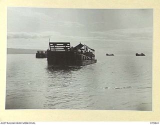 KALAI PLANTATION, NEW BRITAIN. 1945-03-15. THE ARRIVAL OF AUSTRALIAN LANDING CRAFT CARRYING PERSONNEL OF THE 16TH INFANTRY BATTALION, 13TH INFANTRY BRIGADE