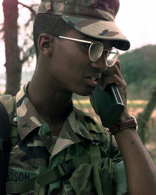 LCPL Cornelius Harrison performs a radio check beginning his shift at the security gate at Marine Expeditionary Camp-Pohang (MEC-P), Oct. 11, 1998. Harrison, originally from Plum Branch, S.C., is out of the Combat Service Support Group, Kaneohe Bay, Hawaii, and is deployed to MEC-P in support of Foal Eagle '98 for two months