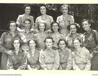 HELDSBACH MISSION, FINSCHHAFEN AREA, NEW GUINEA. 1944-03-13. SISTERS OF THE 2/3RD AND 106TH CASUALTY CLEARING STATION, AUSTRALIAN ARMY NURSING SERVICE OUTSIDE THEIR MESS. VFX8396 SISTER J. LANGHAM, ..