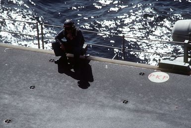 A flight deck crewman aboard the amphibious assault ship USS SAIPAN (LHA-2) takes a break during exercise Ocean Venture '81