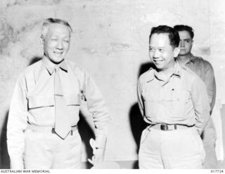 New Guinea. 19 November 1944. President Sergio Osmena of the Philippines (left) with a member of his personal staff, during discussions for invasion of the Philippines