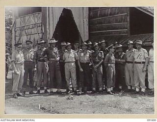 LAE, NEW GUINEA, 1945-05-09. AN INFORMAL GATHERING OF STAFF AND PATIENTS OUTSIDE THE CHAPEL AT 112 CONVALESCENT DEPOT AT THE CONCLUSION OF A THANKSGIVING SERVICE CONDUCTED BY CHAPLAIN E.M. WATTS TO ..