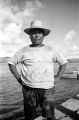 Guam, portrait of man in straw hat