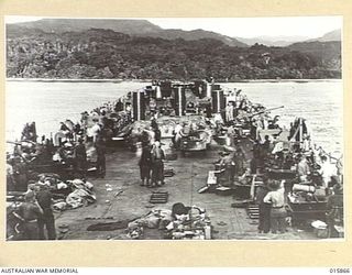 1943-09-29. NEW GUINEA. ATTACK ON FINSCHHAFEN. LANDING BARGES NEAR THE BEACH FROM WHICH TROOPS DISEMBARK. (NEGATIVE BY MILITARY HISTORY NEGATIVES)