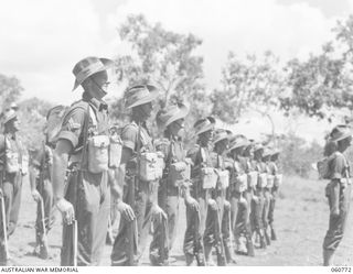 POM POM VALLEY, NEW GUINEA. 1943-11-27. CLOSE UP OF THE GUARD OF THE 2/10TH AUSTRALIAN INFANTRY BATTALION, CHAMPION GUARD OF THE 18TH AUSTRALIAN INFANTRY BRIGADE PARADING FOR THE TAKING OF A ..