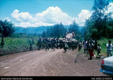 Ceremonial group walking along road