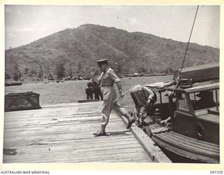 RABAUL, NEW BRITAIN. 1945-09-27. LIEUTENANT GENERAL J. NORTHCOTT, CHIEF OF GENERAL STAFF, ON TOBOI WHARF AFTER ARRIVING AT HEADQUARTERS 11 DIVISION BY CATALINA AIRCRAFT FOR A TOUR OF THE AREA