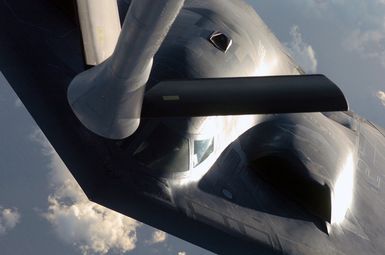 Over the Pacific Ocean a US Air Force (USAF) B-2 Spirit bomber, 509th Bomber Wing (BW), Whiteman Air Force Base (AFB), Missouri (MO), prepares to refuels from an Illinois Air National Guard (ILANG) KC-135 Stratotanker, 126th Air Refueling Wing (ARW), Scott AFB, during a deployment to Andersen Air Force Base (AFB), Guam (GU). The bomber deployed as part of a rotation that has provided US Pacific Command (USPACOM) officials a continuous bomber presence in the Asia-Pacific region, enhancing regional security and the US commitment to the Western Pacific