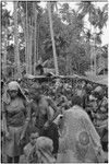 Mortuary ceremony, Omarakana: crowd of mourning women at exchange of banana leaf bundles, Annette Weiner (center distance)