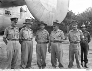 TOROKINA, BOUGAINVILLE. 1945-04-11. LT-GEN J. NORTHCOTT, CHIEF OF THE GENERAL STAFF (4), WITH A GROUP OF OFFICERS ABOUT TO LEAVE PIVA AIRSTRIP. IDENTIFIED PERSONNEL ARE:- BRIG S.F. LEGGE (1); ..