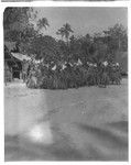 Santa Catalina dancers with leaf skirts and conical hats