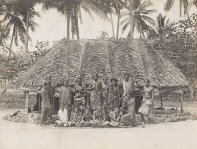 Group of people with a fale. From the album: Photographs of Apia, Samoa