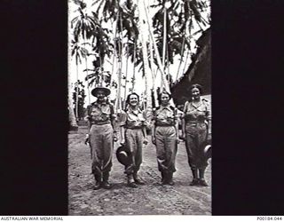 NEW GUINEA. 1944-03. MEMBERS OF THE AUSTRALIAN ARMY NURSING SERVICE, 2/11 AUSTRALIAN GENERAL HOSPITAL, IN THE NURSES COMPOUND. FROM LEFT TO RIGHT: SISTERS FREEMAN; THOM; SULLIVAN; COWAN