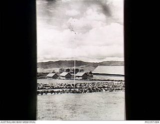 Garoka, New Guinea, 1945-11. The RAAF Aircrew Rest Camp known as 'Lamana', meaning 'Eternal Springs', which is located in the highlands at an altitude of 5,000 feet. At centre, the RAAF flag or ..