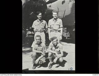 PORT MORESBY, PAPUA. C. 1943. RAAF AND USA AIRMEN WHO FLY TOGETHER AS THE CREW OF AN AMERICAN B-25 MITCHELL BOMBER AIRCRAFT. FRONT ROW, LEFT: STAFF SERGEANT HAROLD W. DICKENSON, GUNNER, USA; ..