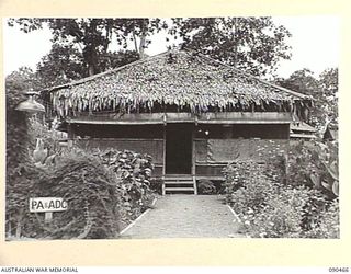 LAE, NEW GUINEA. 1945-04-08. A FRONT VIEW OF THE AIDE-DE-CAMP'S OFFICE, TAKEN DURING THE VISIT OF SENATOR J.M. FRASER, ACTING MINISTER FOR THE ARMY, TO THE AREA