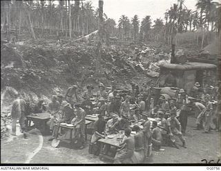 MOMOTE, LOS NEGROS ISLAND, ADMIRALTY ISLANDS. 1944-03-08. RAAF GROUNDSTAFF OF NO. 73 WING AT MESS IN A REVETMENT BUILT BY THE JAPANESE TO PROTECT THEIR AIRCRAFT FROM BOMBING