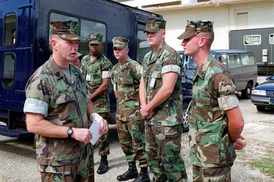 Sergeant Major Joel Williams, Sergeant Major Marine Forces Pacific, talks with Marine Forces personnel stationed at Andersen South, Guam, during Operation PACIFIC HAVEN. PACIFIC HAVEN provided Kurdish evacuees political asylum from Iraq. While on Guam, the Kurds are provided shelter, food, clothing, medical care and assimilation classes for life in the United States