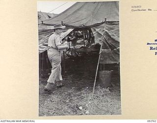 WEWAK AREA, NEW GUINEA. 1945-06-03. MISS BOWN, RED CROSS SOCIETY REPRESENTATIVE AT 104 CASUALTY CLEARING STATION VISITING THE WARDS WITH A FEW CIGARETTES AND BARLEY SUGAR FOR SOME OF THE PATIENTS