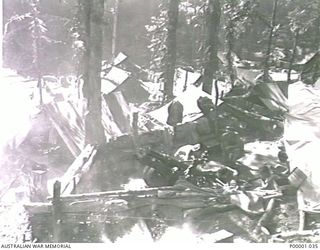 THE SOLOMON ISLANDS, 1945-01-12. AN AIF 25 POUND GUN IN ACTION. (RNZAF OFFICIAL PHOTOGRAPH.)