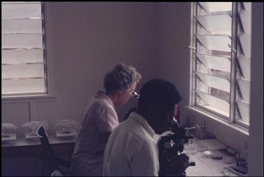 In the laboratory (Margaret Spencer with Jonathan Baloiloi) (2) : Bougainville Island, Papua New Guinea, April 1971 / Terence and Margaret Spencer