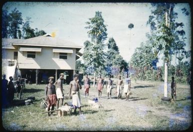 Carriers assemble for the first patrol after the eruption, Popondetta, Papua New Guinea, 1951 / Albert Speer