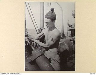 MIOS WUNDI HARBOUR, DUTCH NEW GUINEA. 1944-11-15. THE MECHANISM OF THE DEPTH CHARGE THROWER ABOARD HMAS KIAMA
